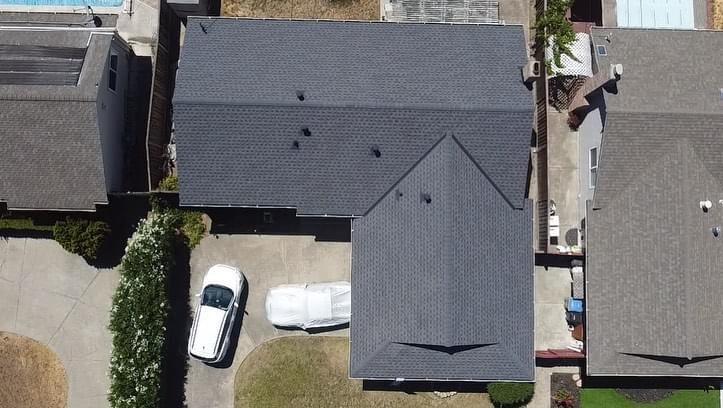 roofing orlando-arial view of new gray roofing shingles on a home