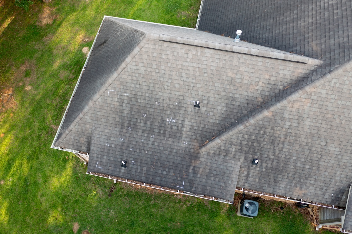 Roof with hail damage and markings from inspection