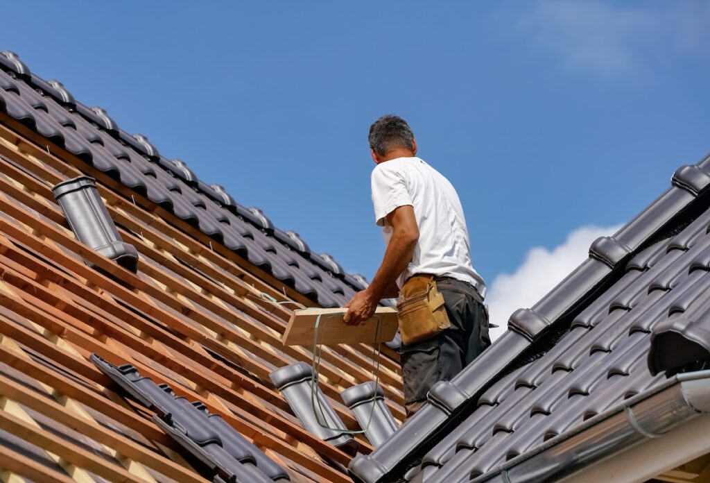 a man on a roof