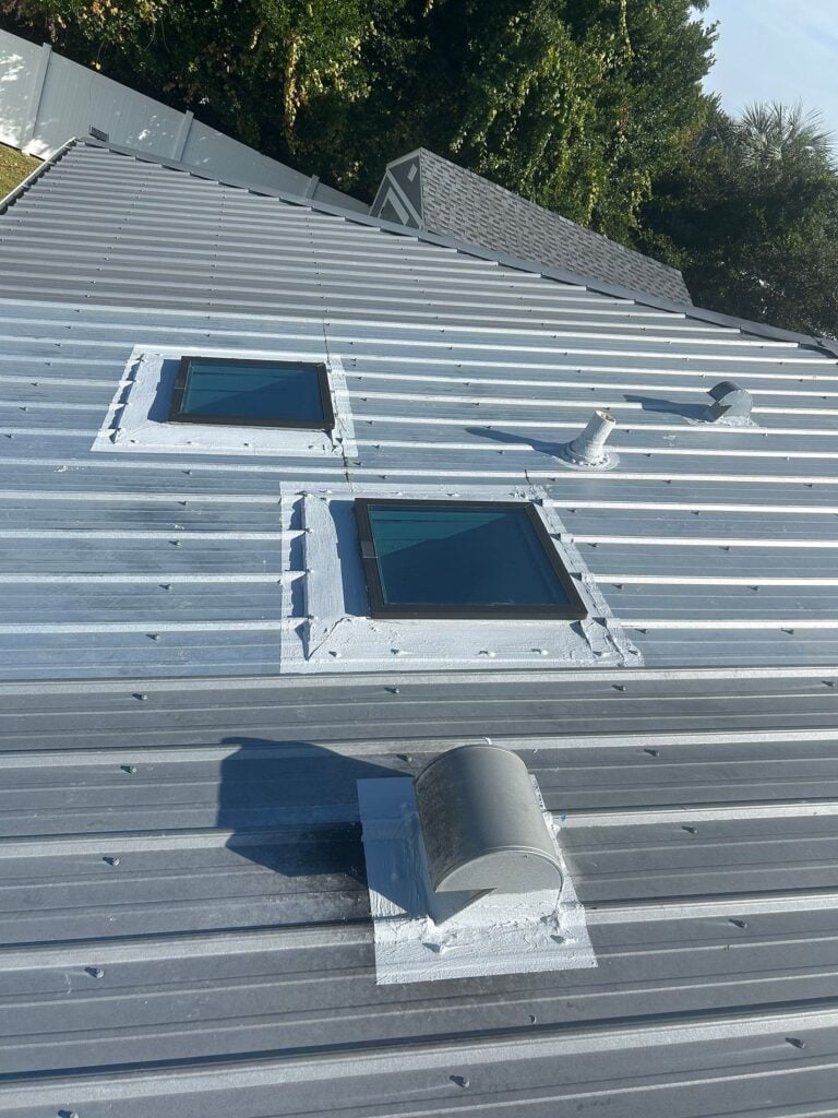 Metal roof skylights after flashing and sealant repairs were completed