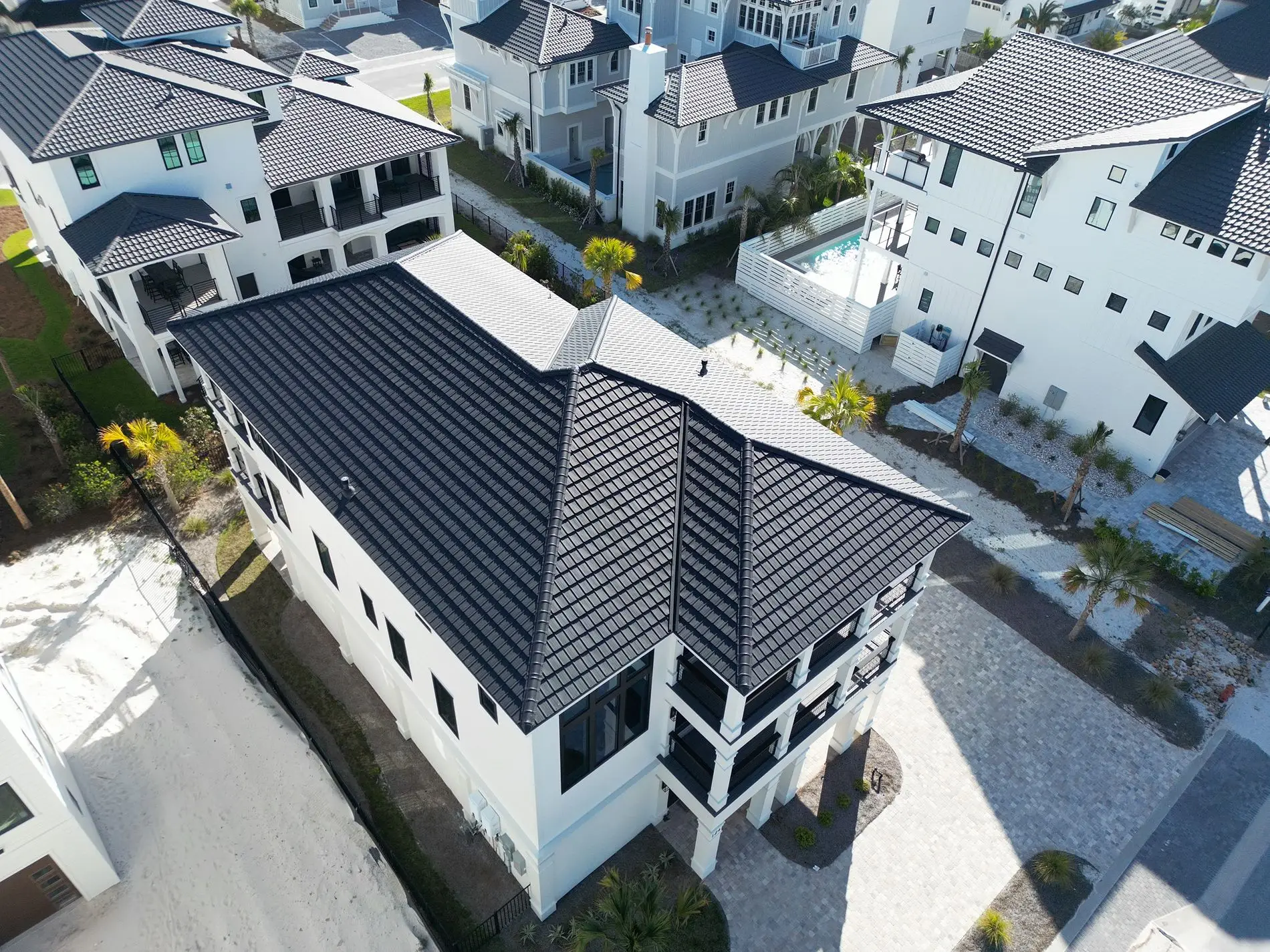 Black tile roofing system installed on a luxury coastal home in Florida