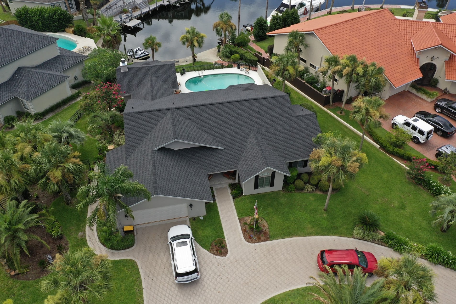 Aerial front view of a dark gray GAF Timberline HDZ shingle roof replacement in Panama City, Florida