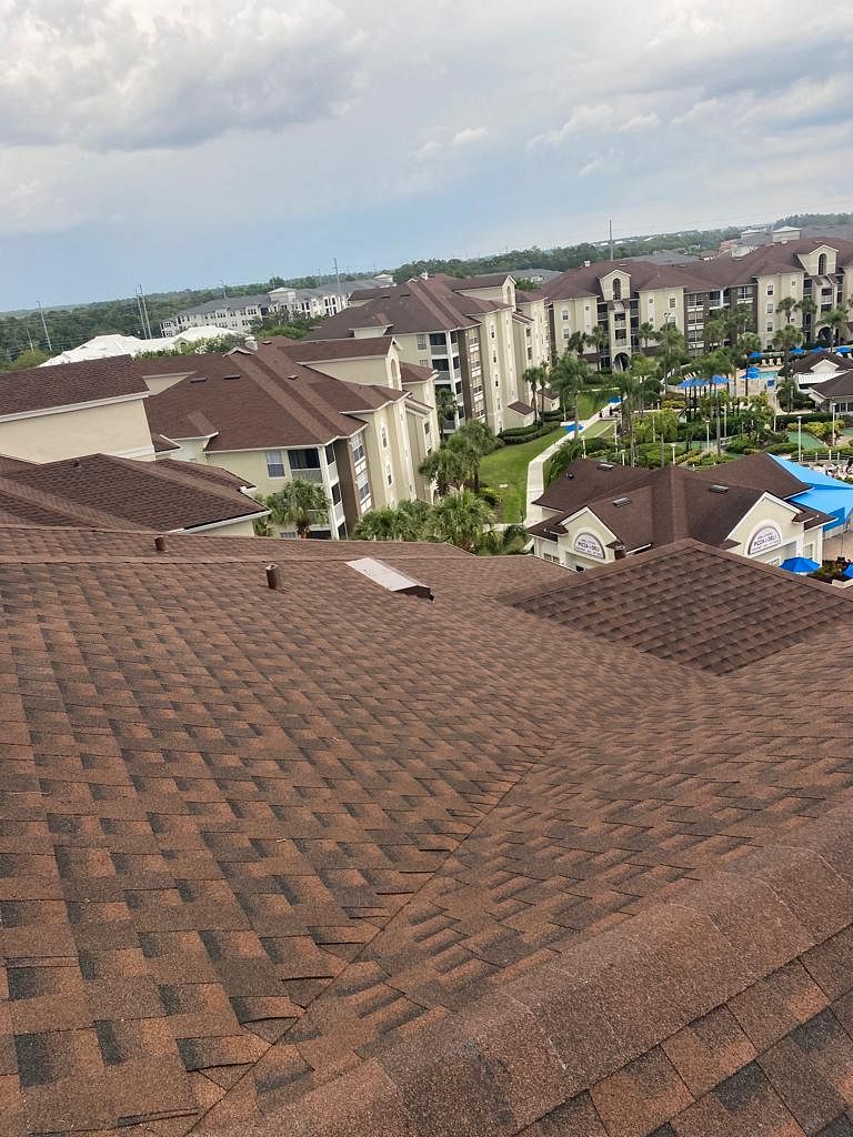 Brown architectural asphalt shingle roofing system installed on a Florida home