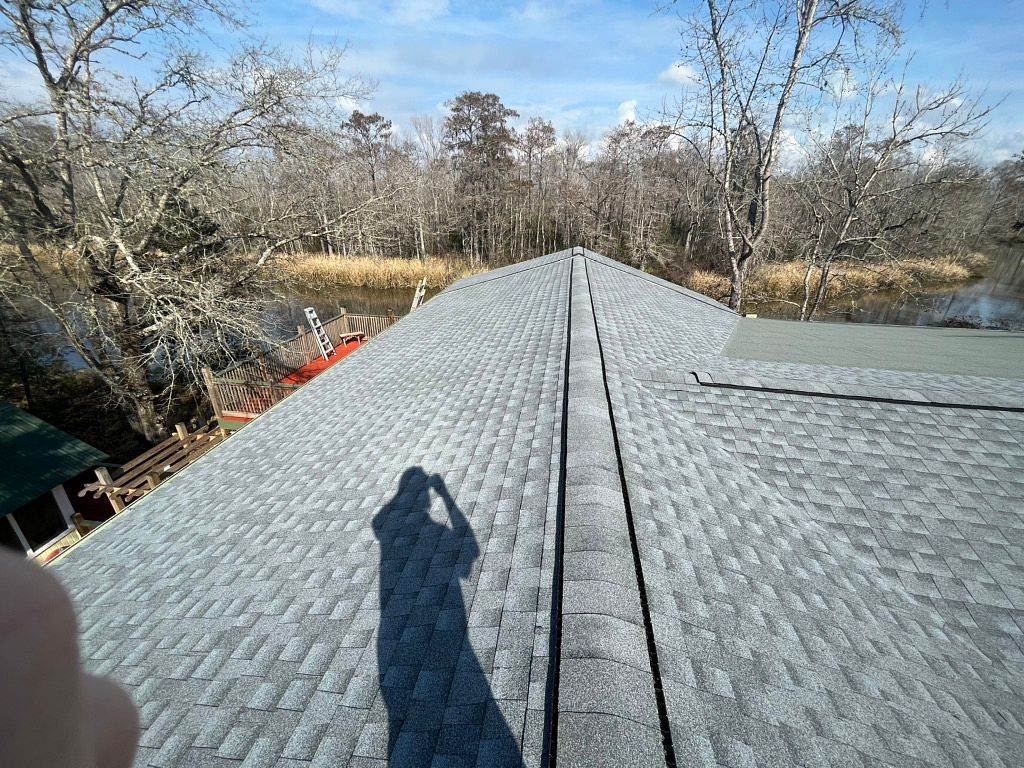Oyster Gray GAF Timberline HDZ architectural shingle roof installed on a home in Vernon, Florida