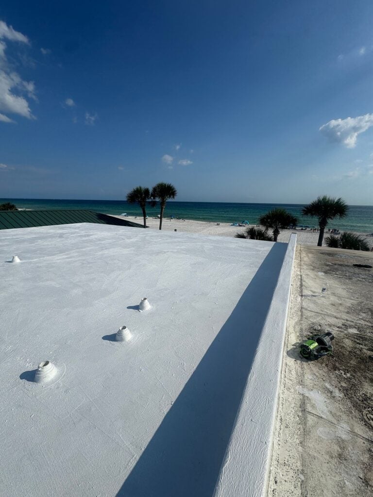 Commercial flat roof after white roof coating restoration near Panama City Beach, FL