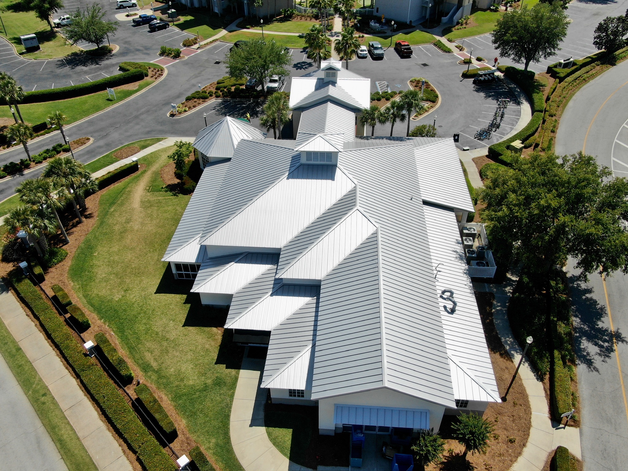 Aerial view of a white standing seam metal roof at Marriott’s Legends Edge in Panama City Beach, Florida