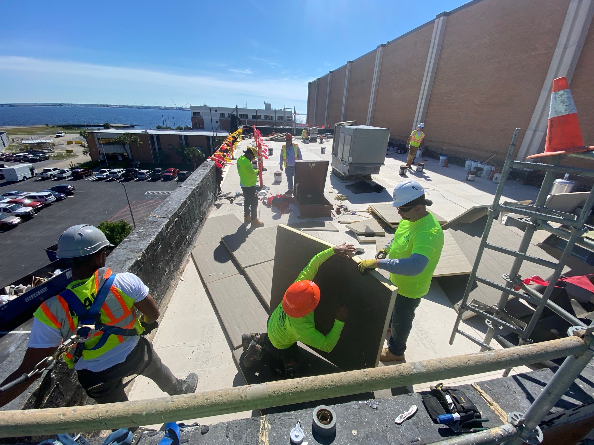 Commercial roofing crew completing a flat roof replacement in Florida