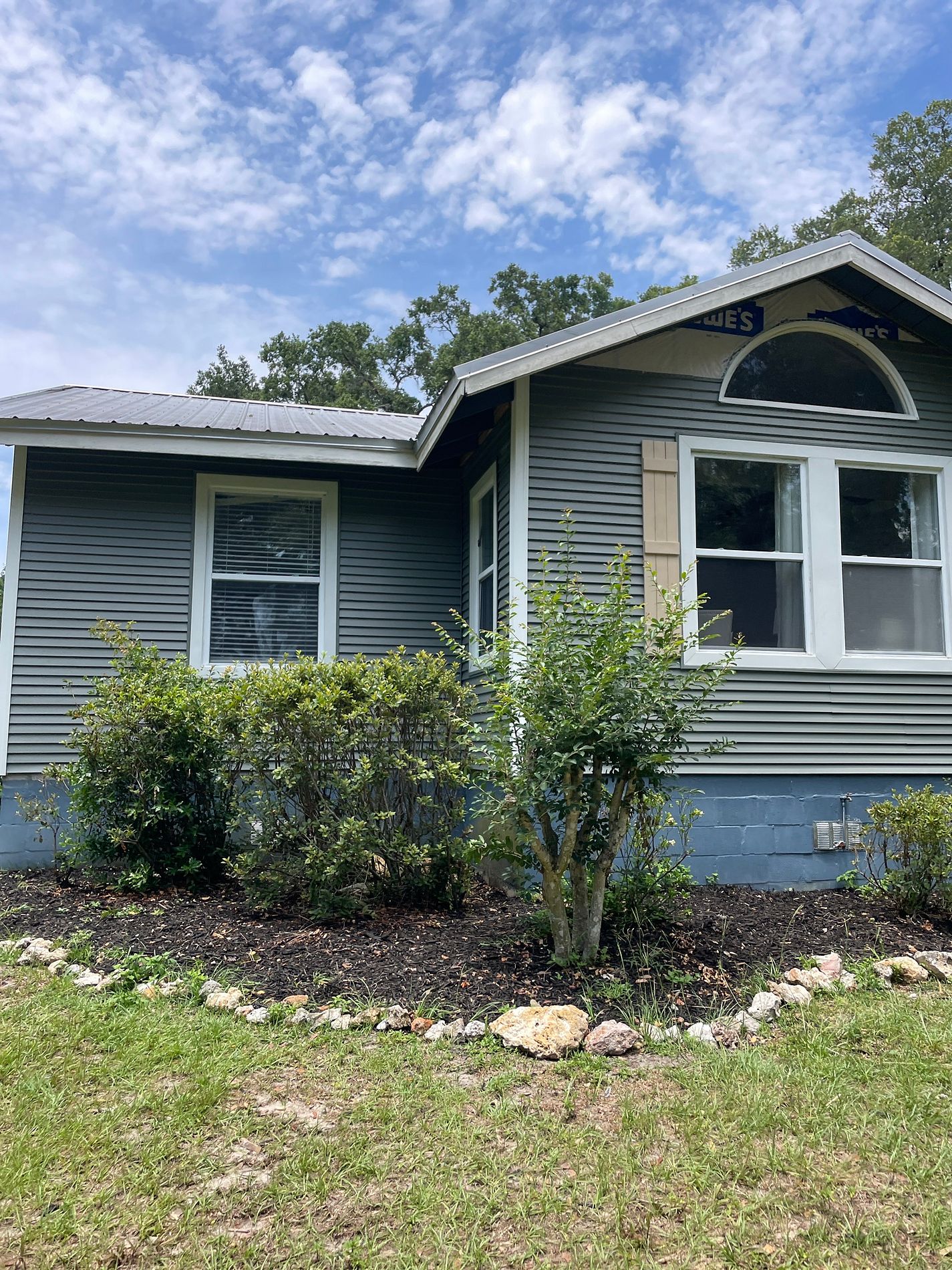 Gray vinyl siding installed on a residential home in Morriston, Florida