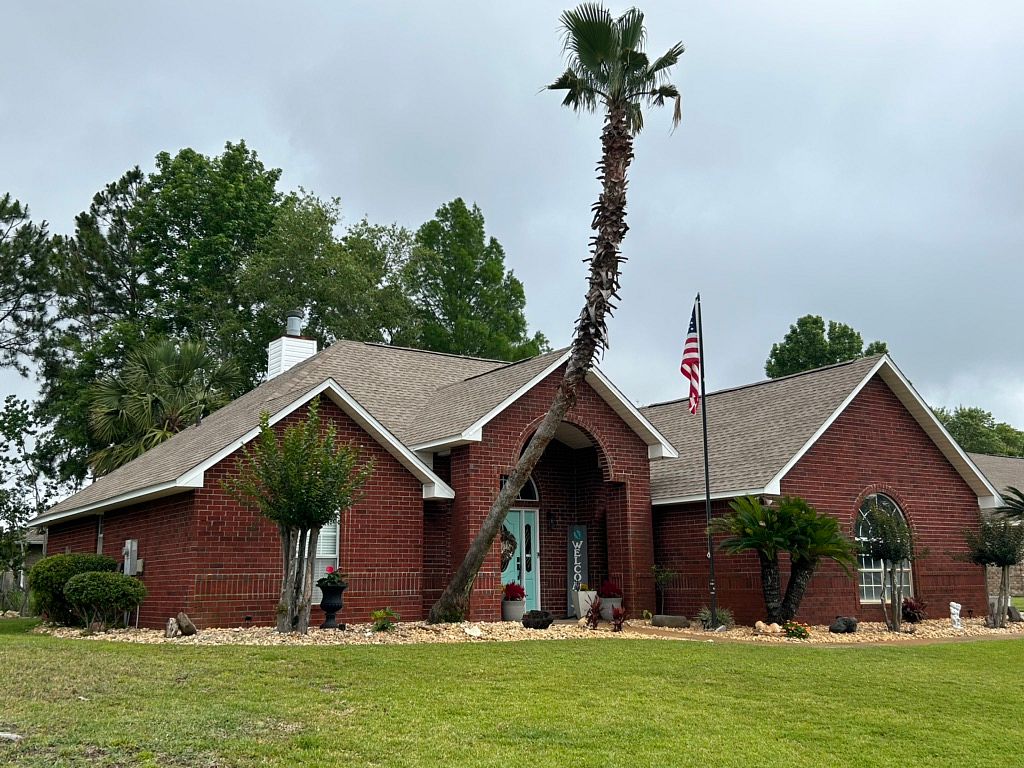 Completed architectural shingle roof on a residential home in Santa Rosa County, Florida