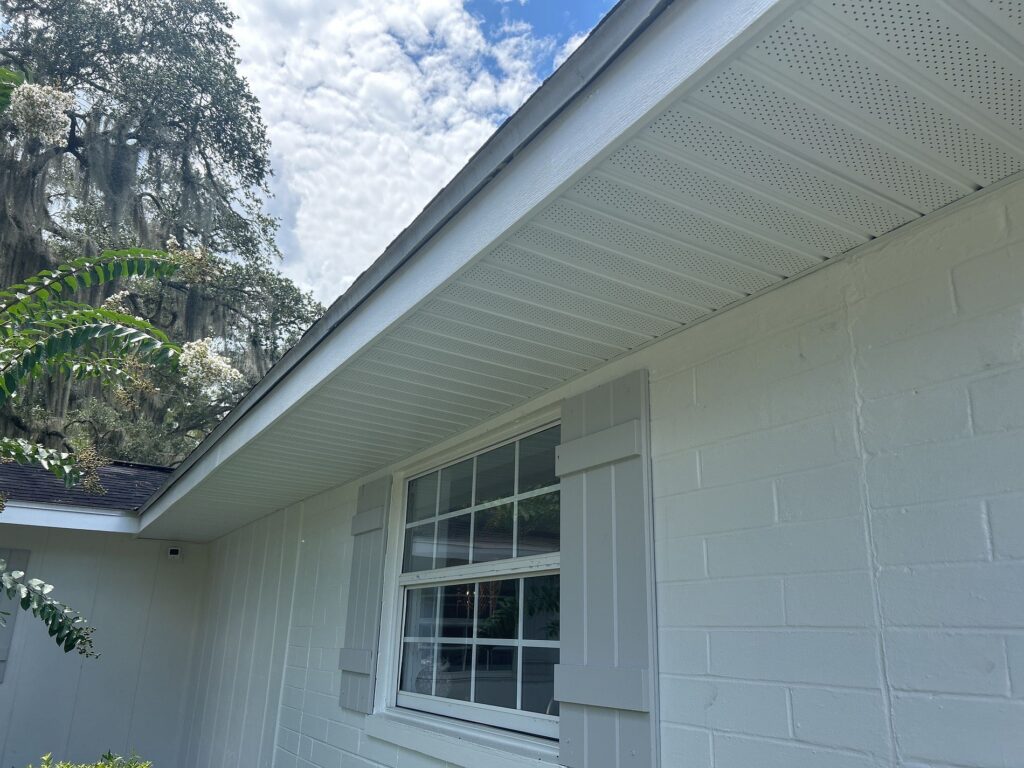 White vented soffit and fascia installed along the roof edge of a Florida home
