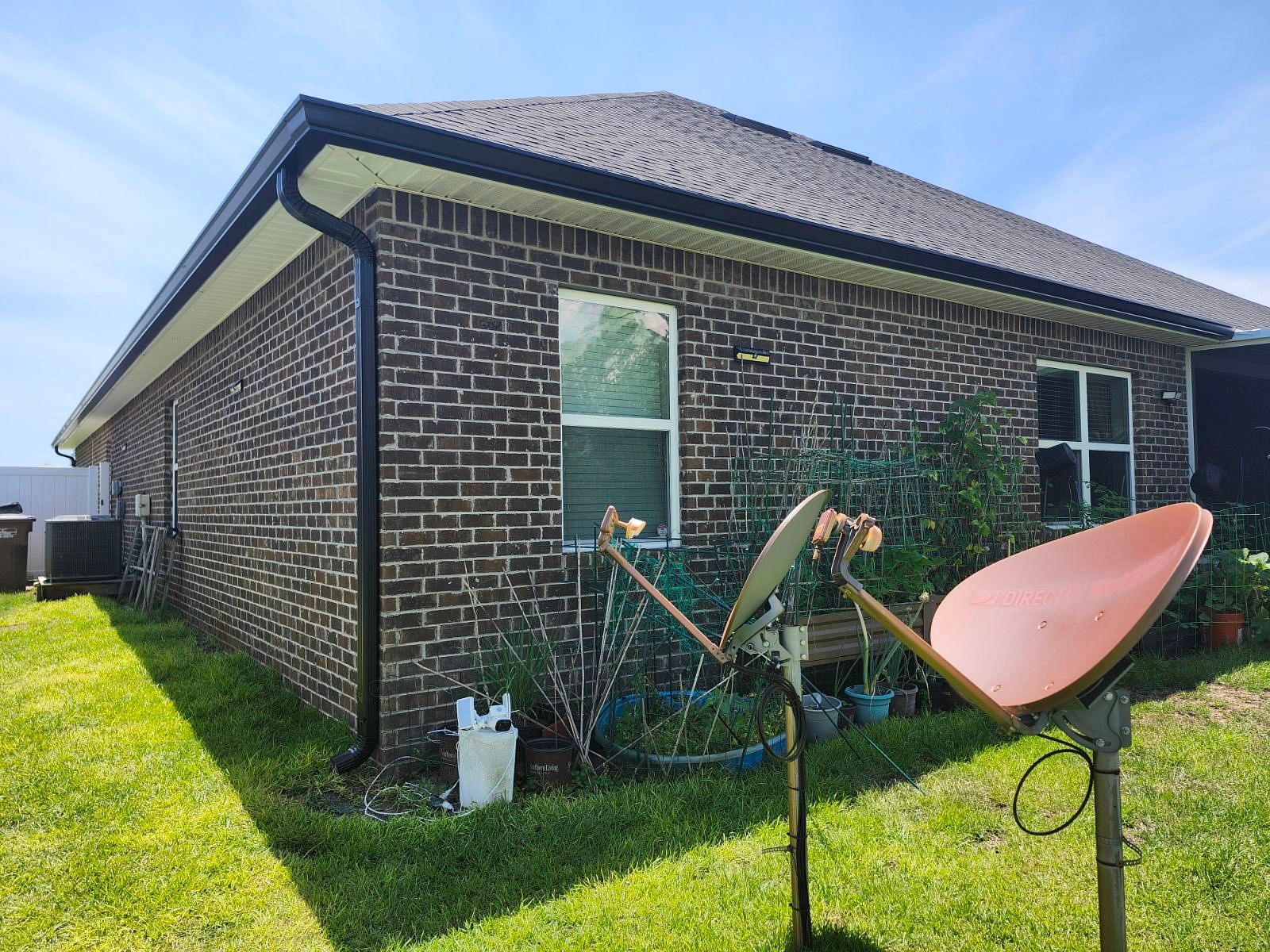 Six-inch seamless gutter system installed on a brick home in Florida