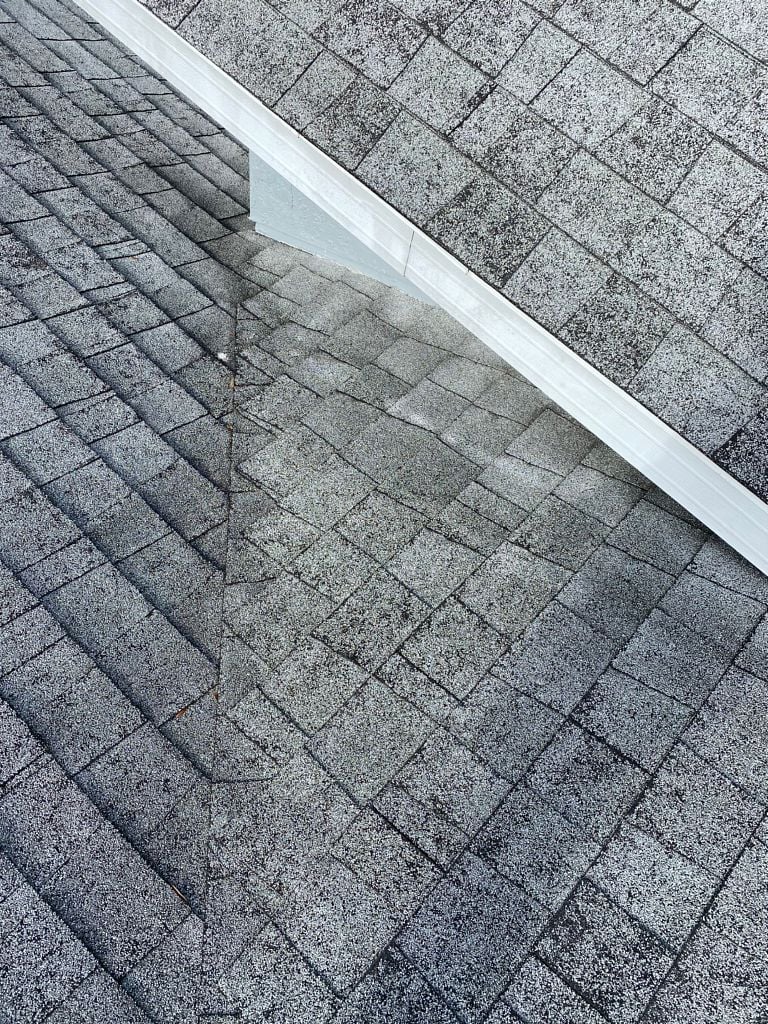Aging asphalt shingle roof with worn and deteriorated shingles in Florida