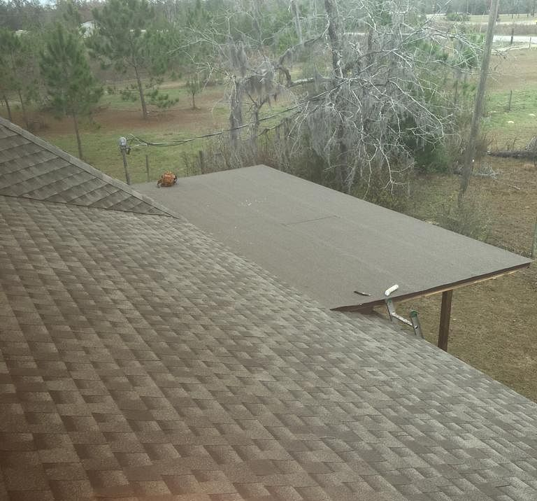Brown GAF Timberline HDZ architectural shingle roof installed on a home in Altha, Florida