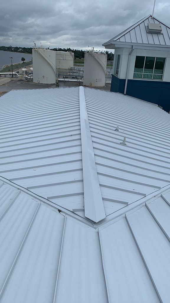White standing seam metal roofing system with concealed fasteners installed in Florida