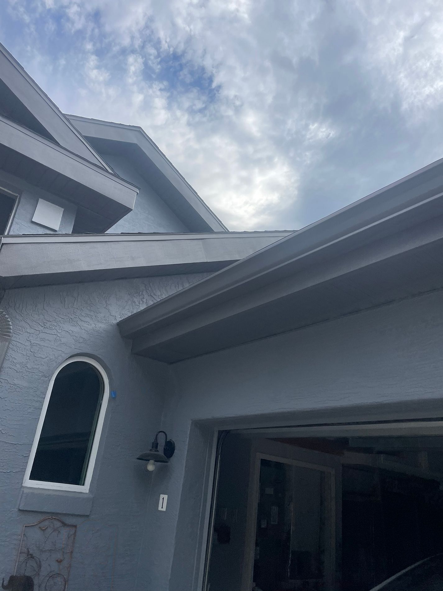 Black aluminum soffit and fascia installed on a residential home in Daytona Beach, Florida
