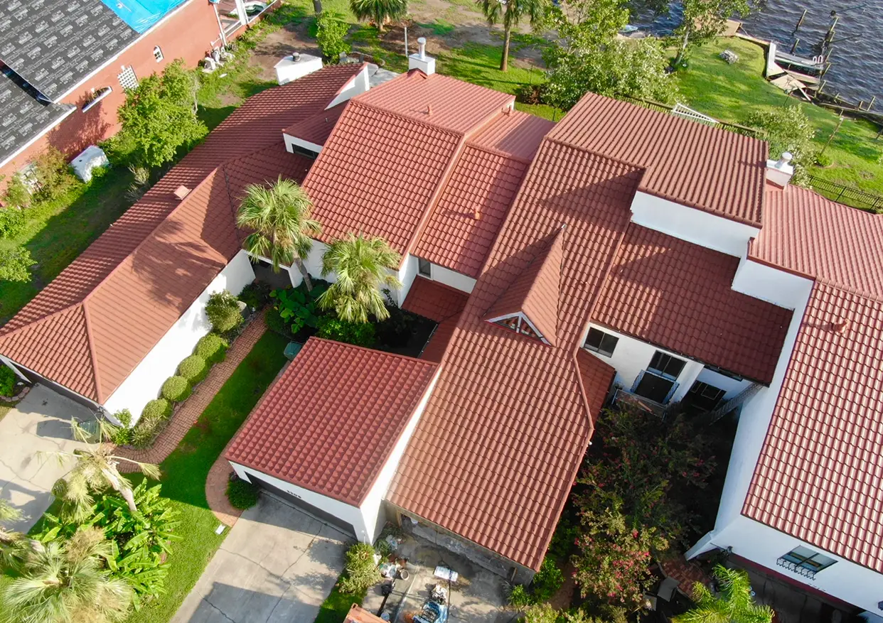 Aerial view of a red Brava Spanish barrel tile roof installed on a luxury Florida home