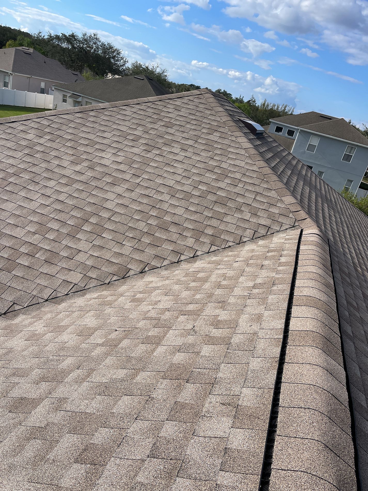 Weathered Wood GAF Timberline HDZ architectural shingle roof installed on a home in Leesburg, Florida