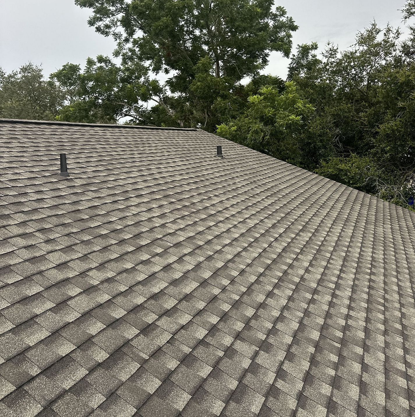 Weathered Wood GAF Timberline HDZ architectural shingle roof installed on a home in Rockledge, Florida