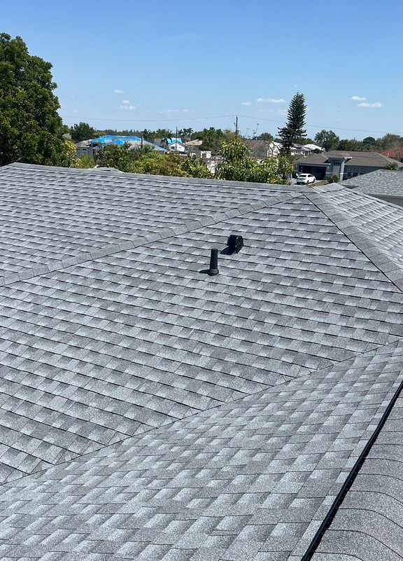 Oyster Gray GAF Timberline HDZ architectural shingle roof installed on a home in Clewiston, Florida