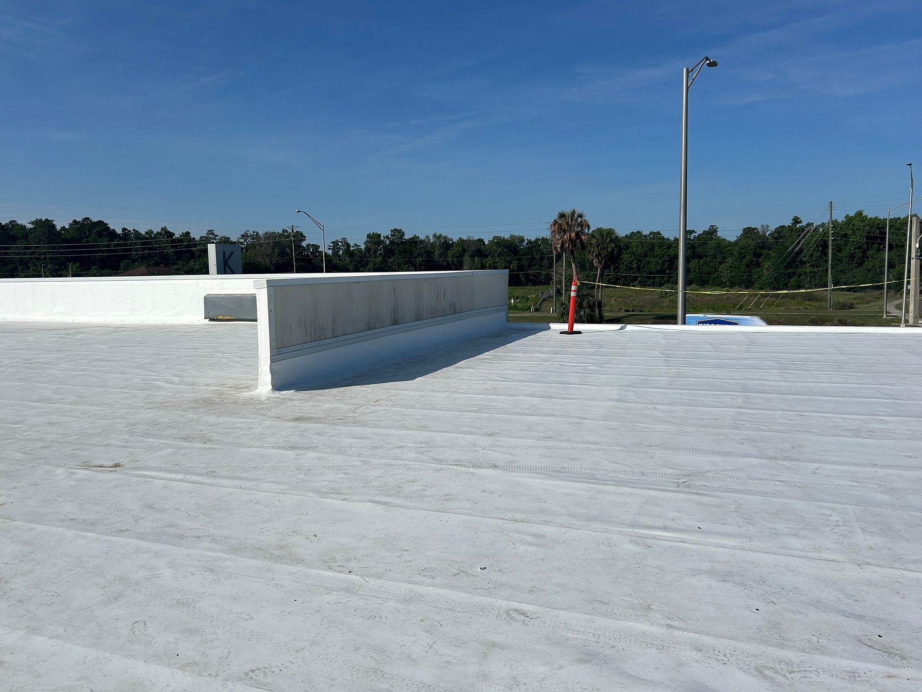 TPO commercial roof replacement at Koontz Furniture Store in Ocala, Florida