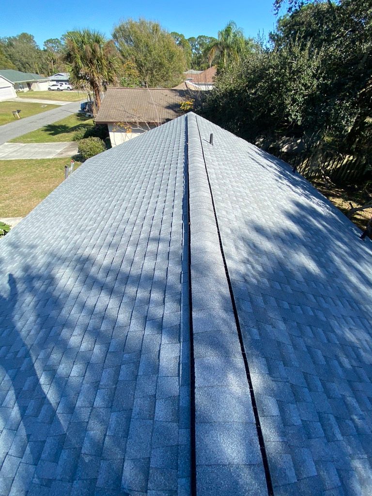 Oyster Gray GAF Timberline HDZ architectural shingle roof installed on a home in Palm Bay, Florida