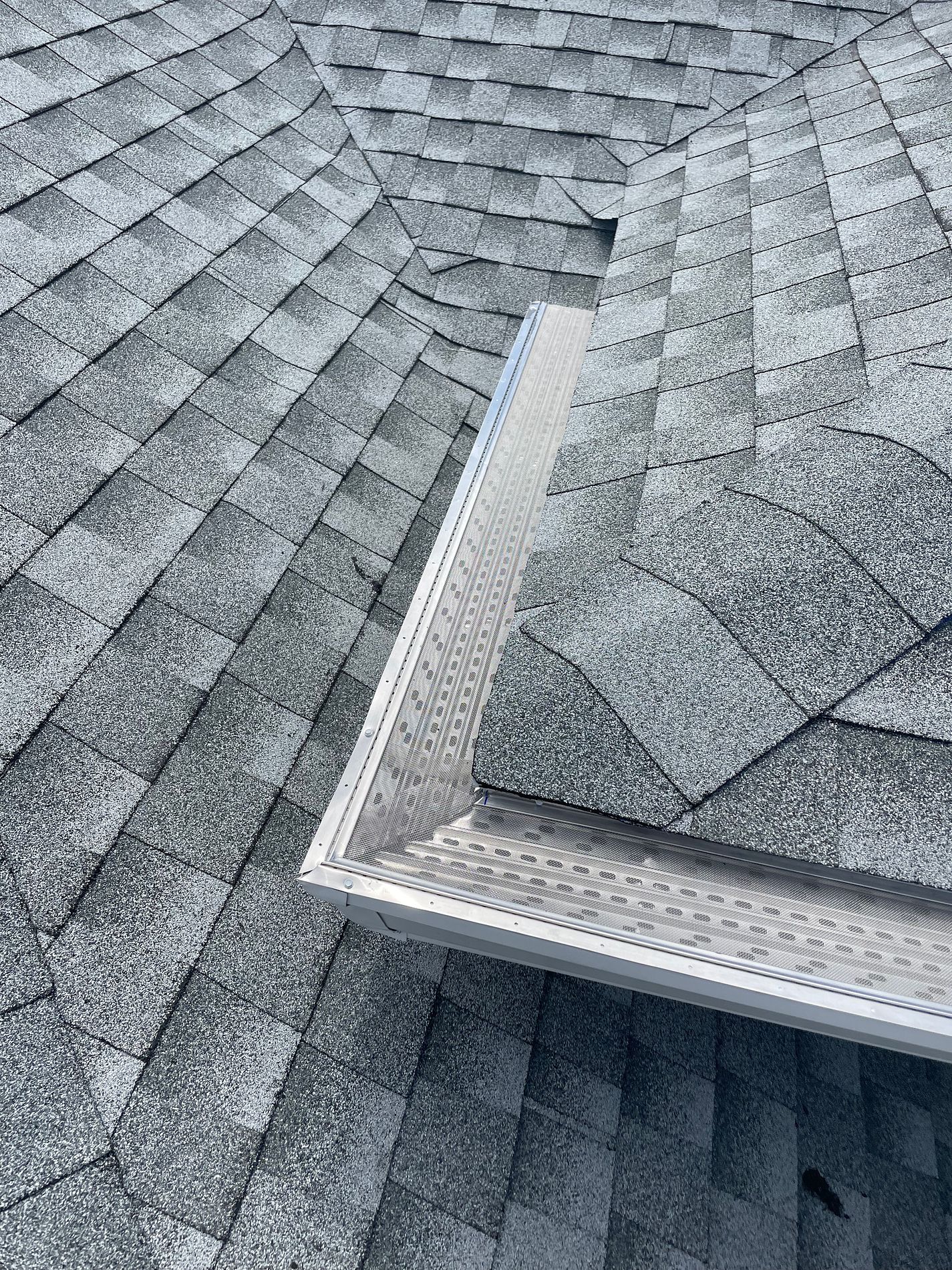 White 6-inch K-style gutter with leaf guard installed on a home in Pembroke Pines, Florida