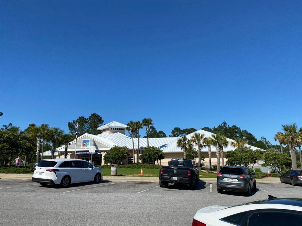 Complete 24-gauge Megaloc standing seam metal roof installation on the Florida Visitor Center along I-10 in Pensacola, FL.