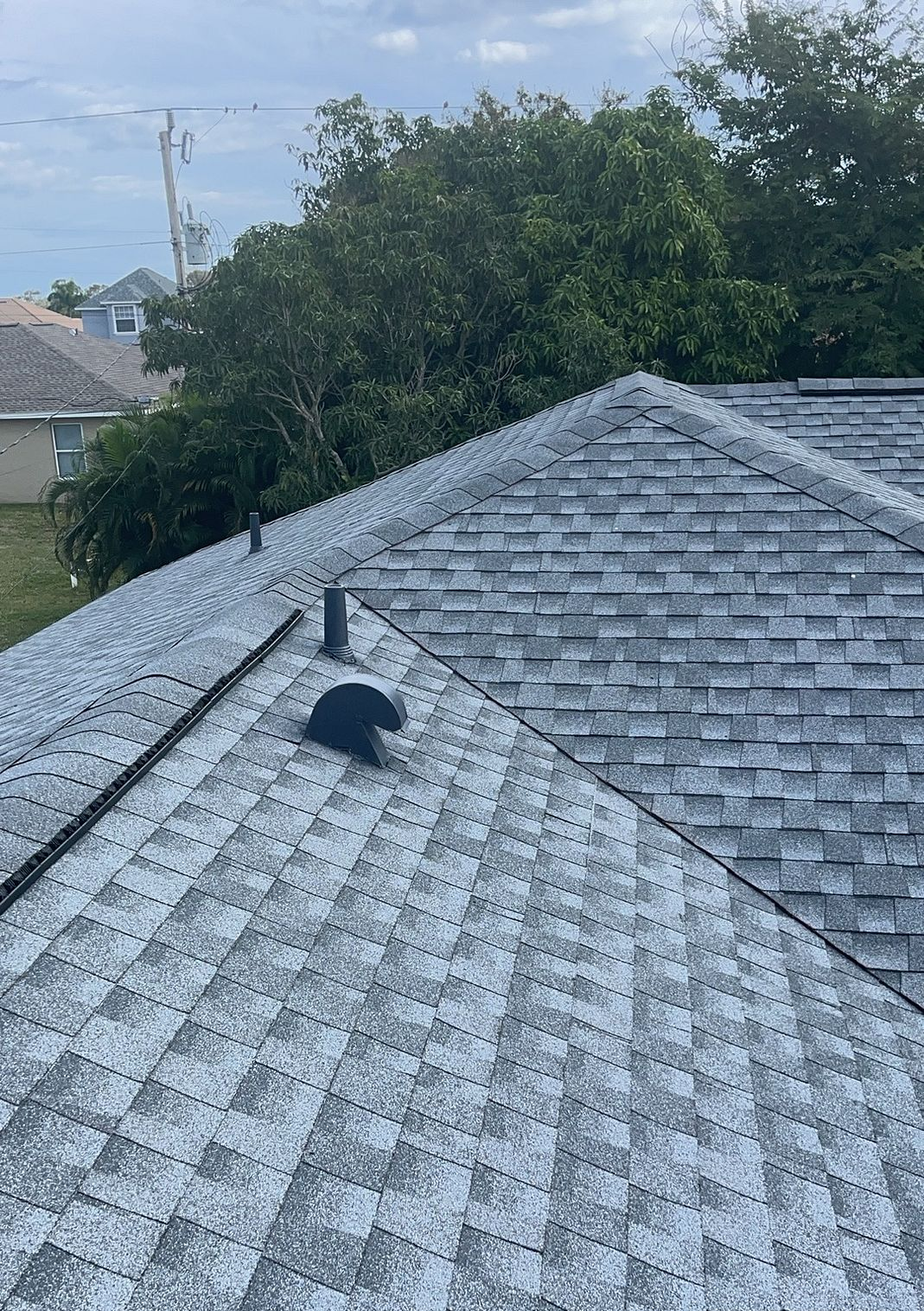 Oyster Gray GAF Timberline HDZ architectural shingle roof installed on a home in Miami, Florida