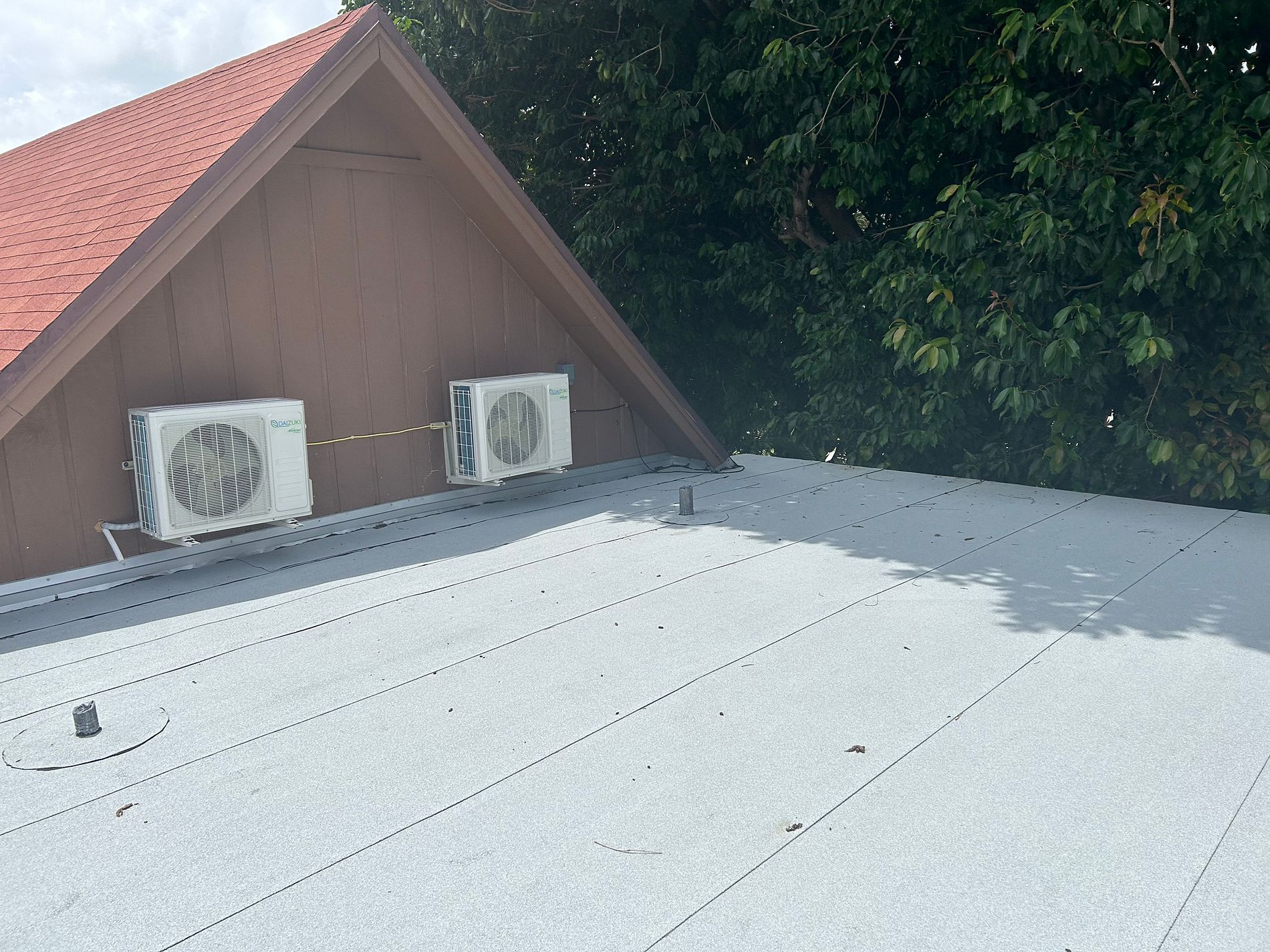 White modified bitumen roofing system installed on a property in Boca Raton, Florida