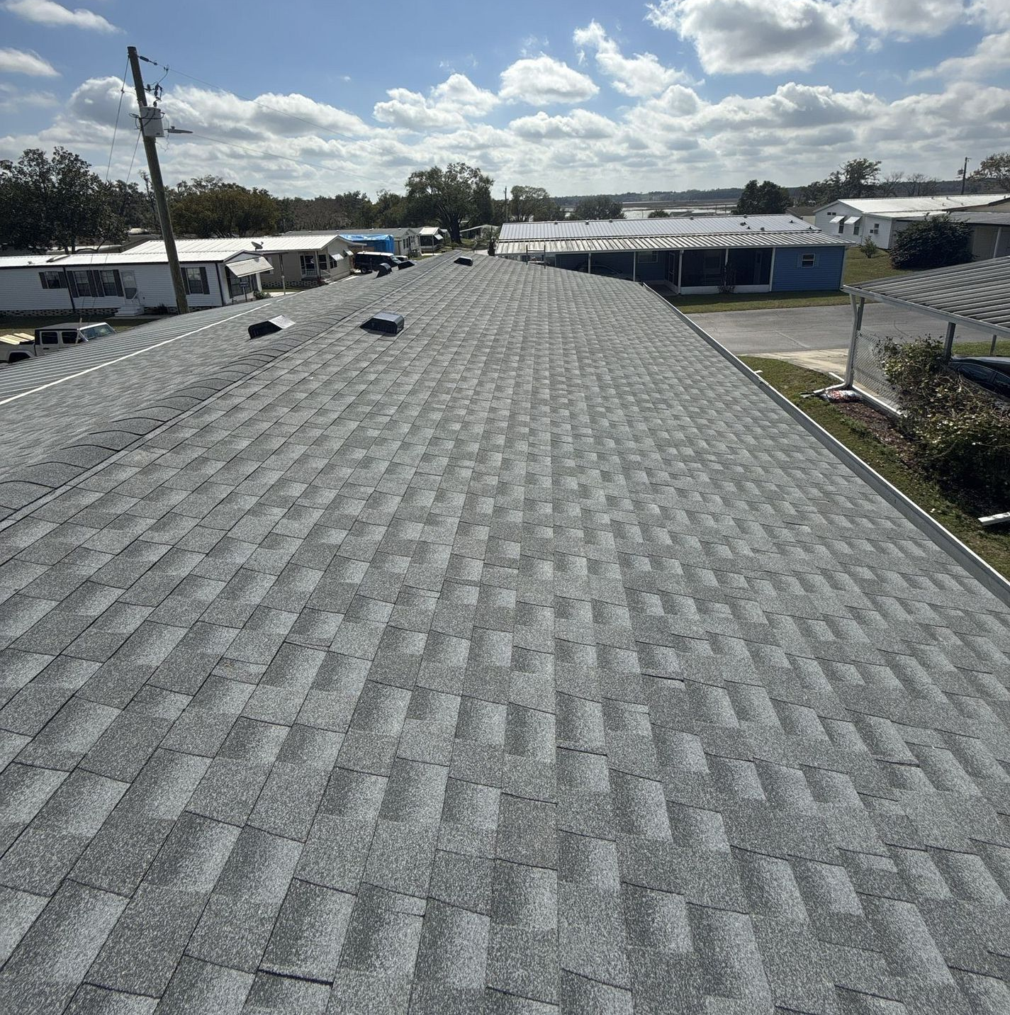 Oyster Gray GAF Timberline HDZ architectural shingle roof installed on a home in Dade City, Florida