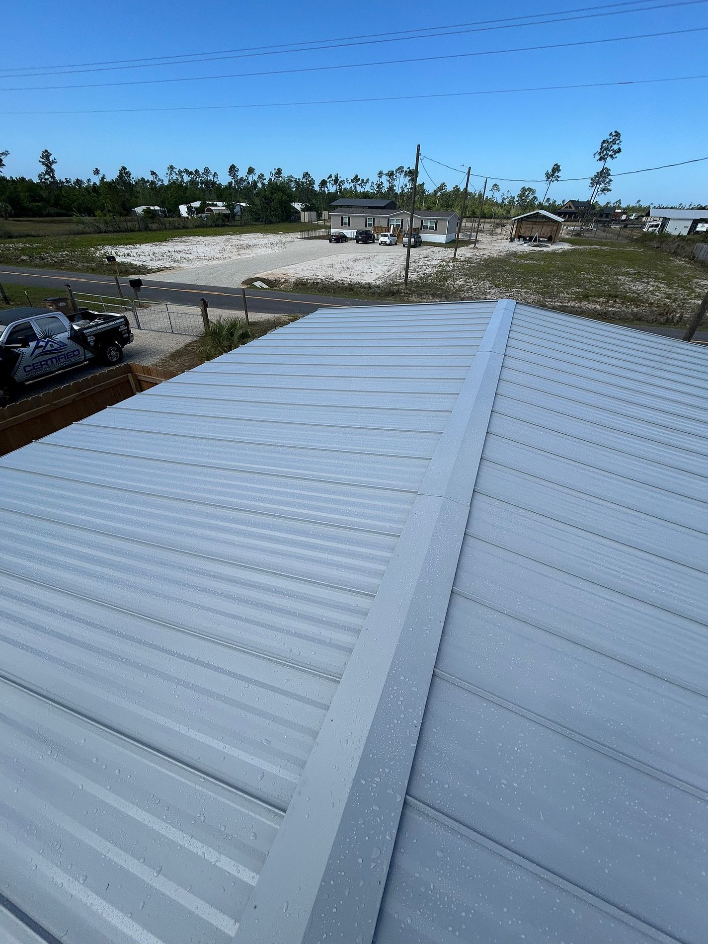 White standing seam metal roof installed on a property in Port St. Joe, Florida