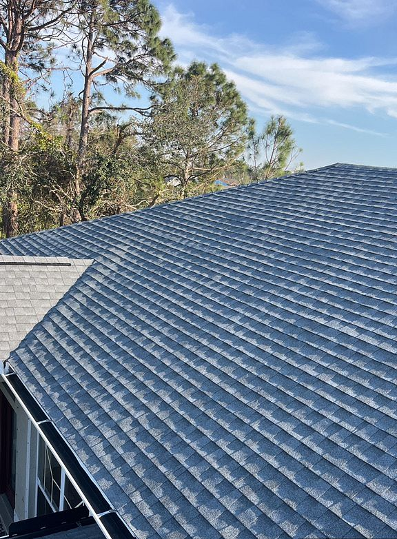 Oyster Gray GAF Timberline HDZ architectural shingle roof installed on a home in Port Salerno, Florida