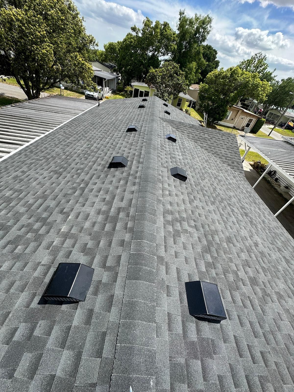Charcoal GAF Timberline HDZ architectural shingle roof installed on a home in Cypress Quarters, Florida