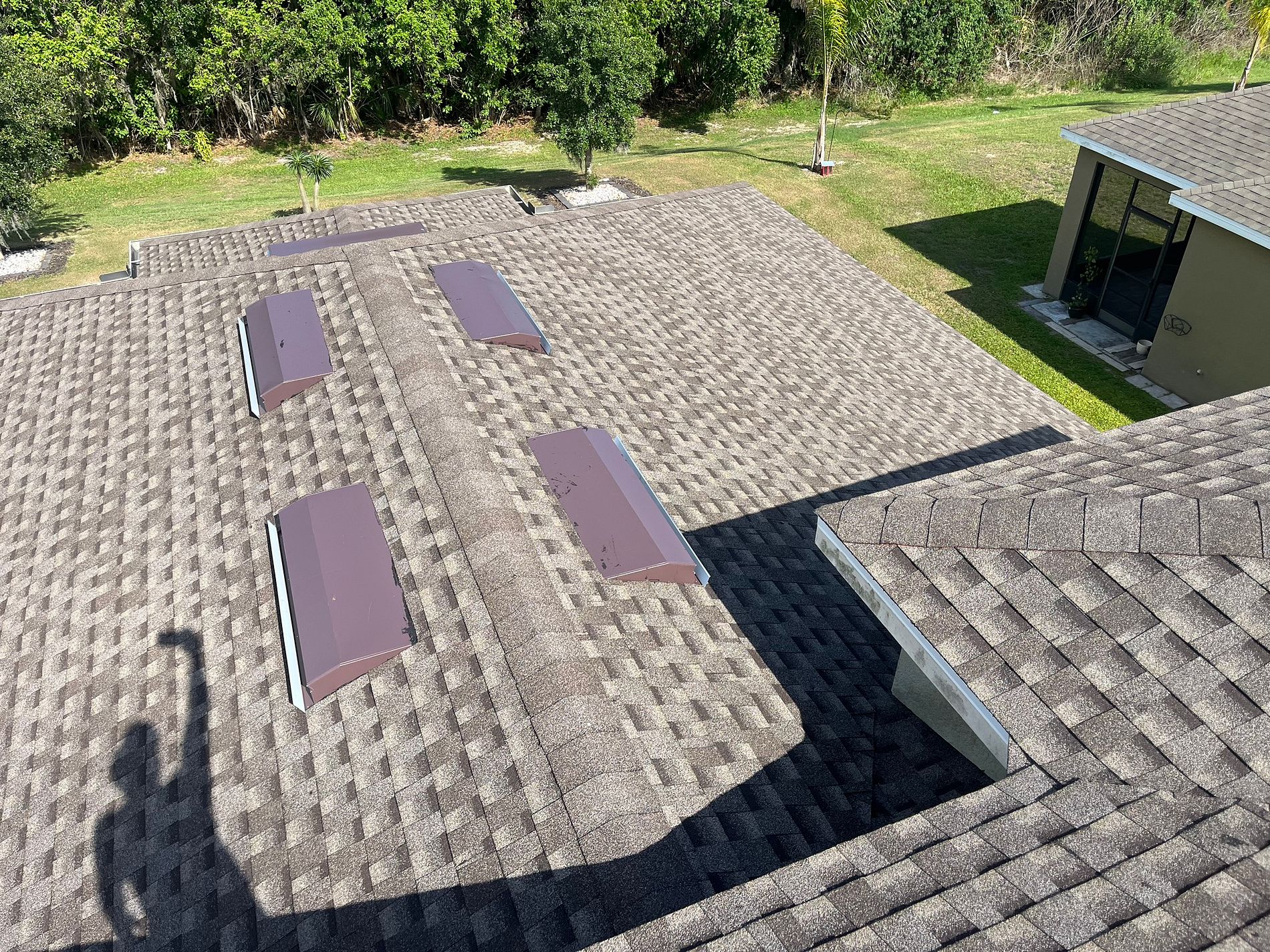 Mission Brown GAF Timberline HDZ architectural shingle roof installed on a home in Kissimmee, Florida