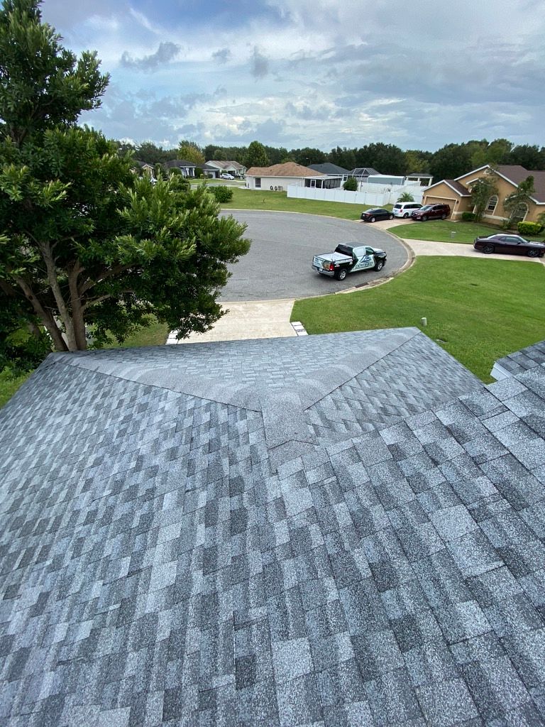 Oyster Gray GAF Timberline HDZ architectural shingle roof installed on a home in Lee, Florida