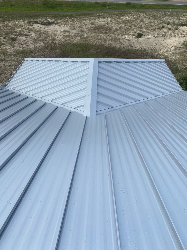 White standing seam metal roof installed on a property on St. George Island, Florida